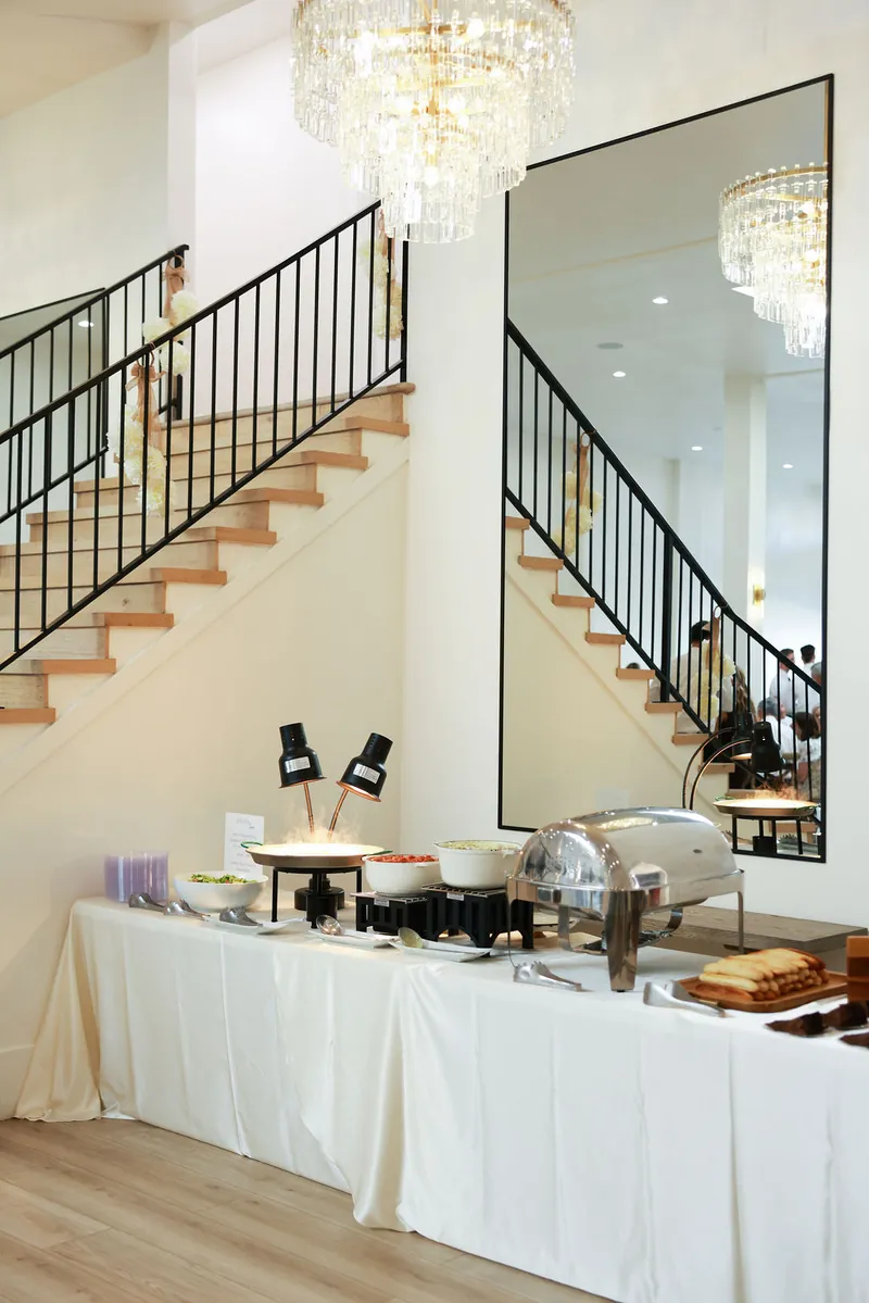 Buffet line set beneath the staircase at Moments on Main event venue, Payson