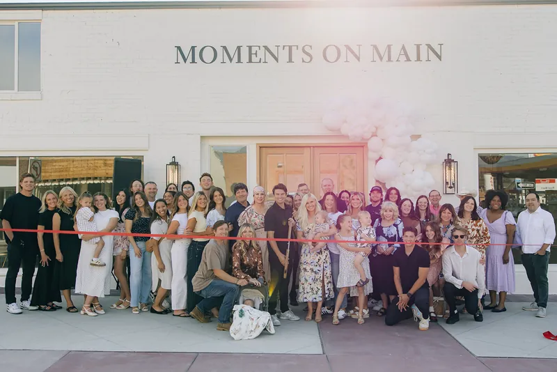 Crowd gathered outside the Moments on Main storefront on Main Street, Payson, Utah