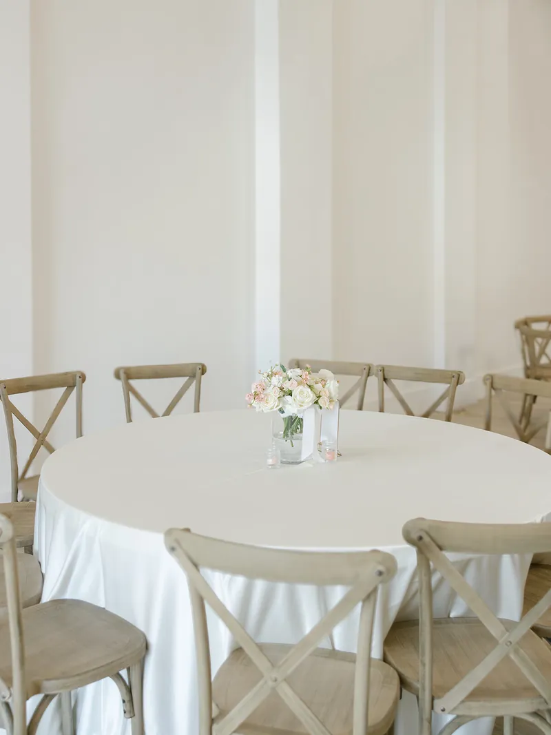 Round luncheon table with linens at Moments on Main, Payson