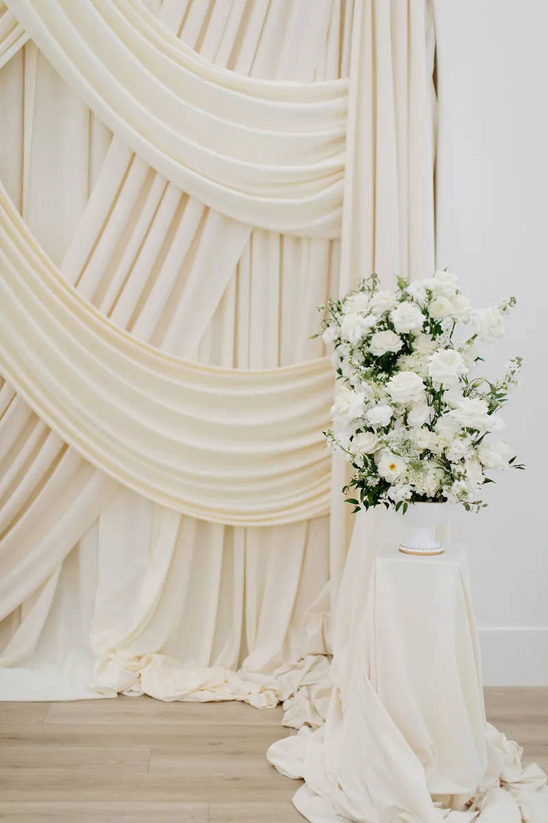 Draping and floral detail at a Moments on Main ceremony, Payson