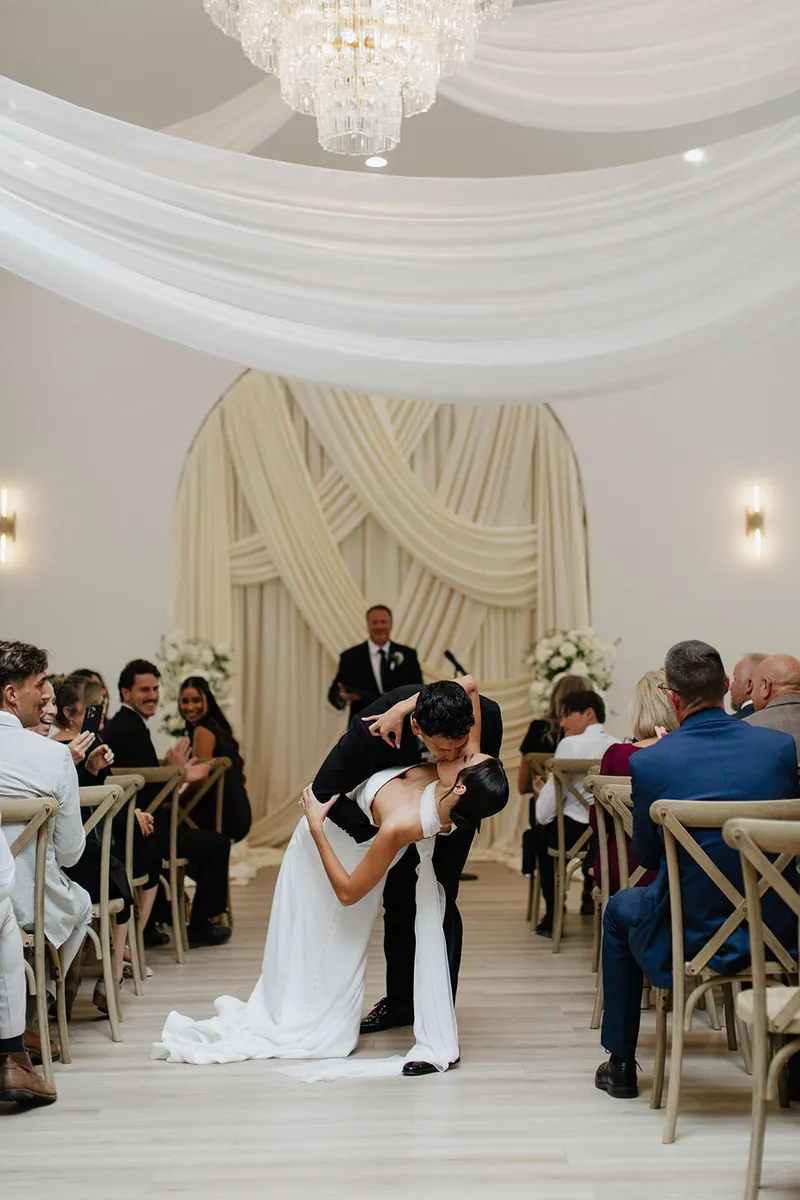 First kiss at a wedding ceremony at Moments on Main, Payson