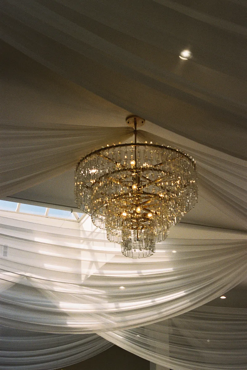 Crystal chandelier and ceiling draping at Moments on Main, Payson, Utah