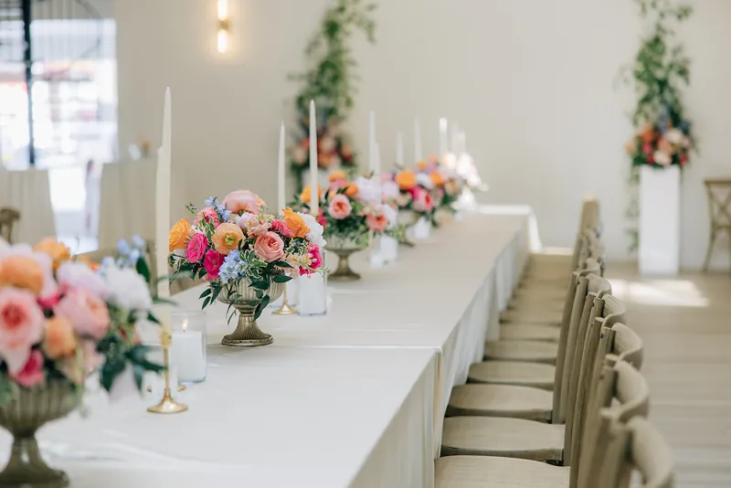 Farmhouse table with florals and candles at Moments on Main, Payson