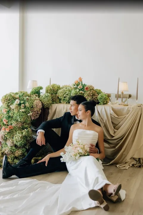 Couple seated in front of hydrangeas at Moments on Main, from Jackie Siggard's Google review